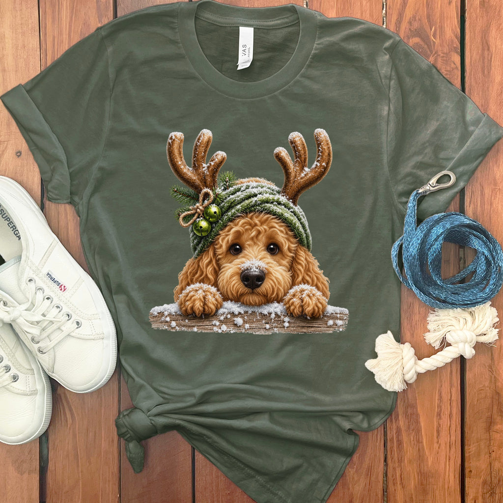 Green t-shirt featuring a doodle dog wearing a Christmas hat with antlers.