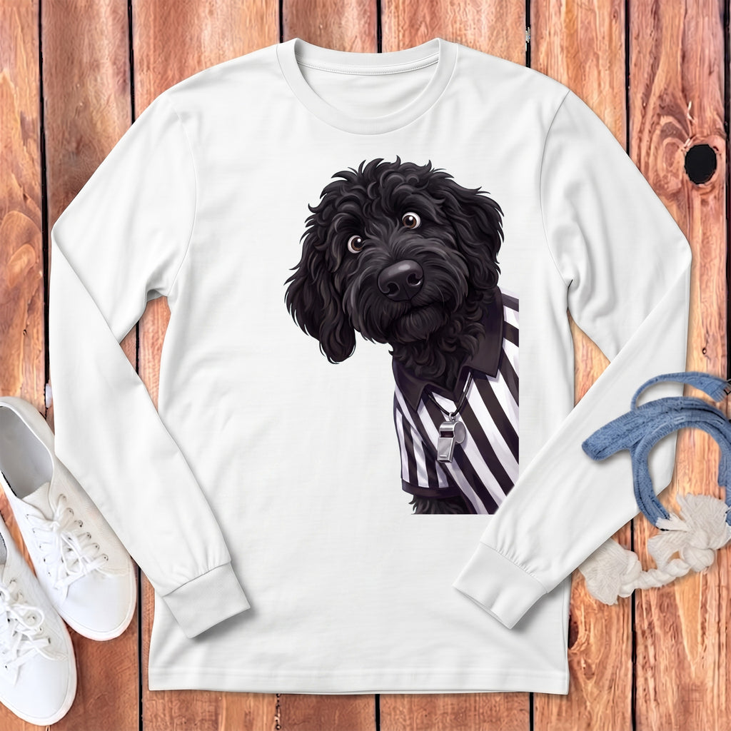 Black dog wearing referee stripes and a whistle on a white long-sleeved shirt.
