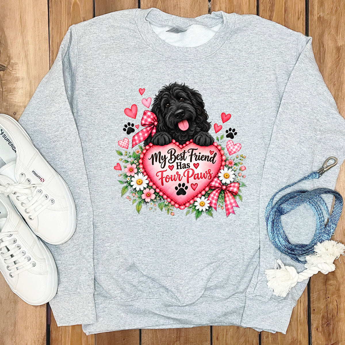 Light gray crewneck sweatshirt featuring a black curly dog graphic with red hearts and flowers.