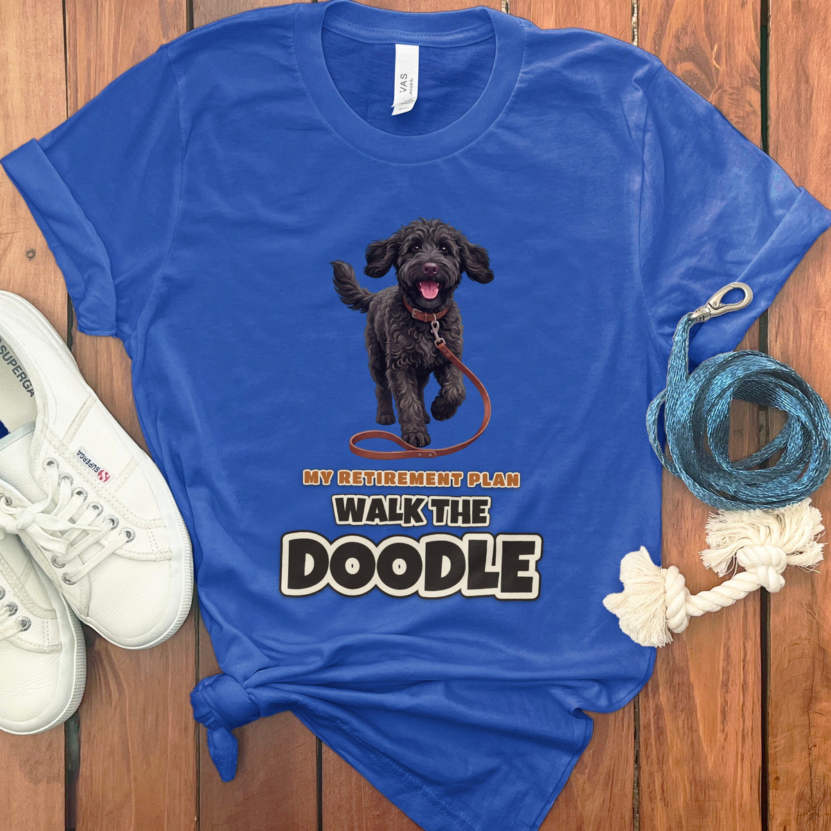 Blue t-shirt with a black doodle dog graphic and text "My Retirement Plan Walk the Doodle".