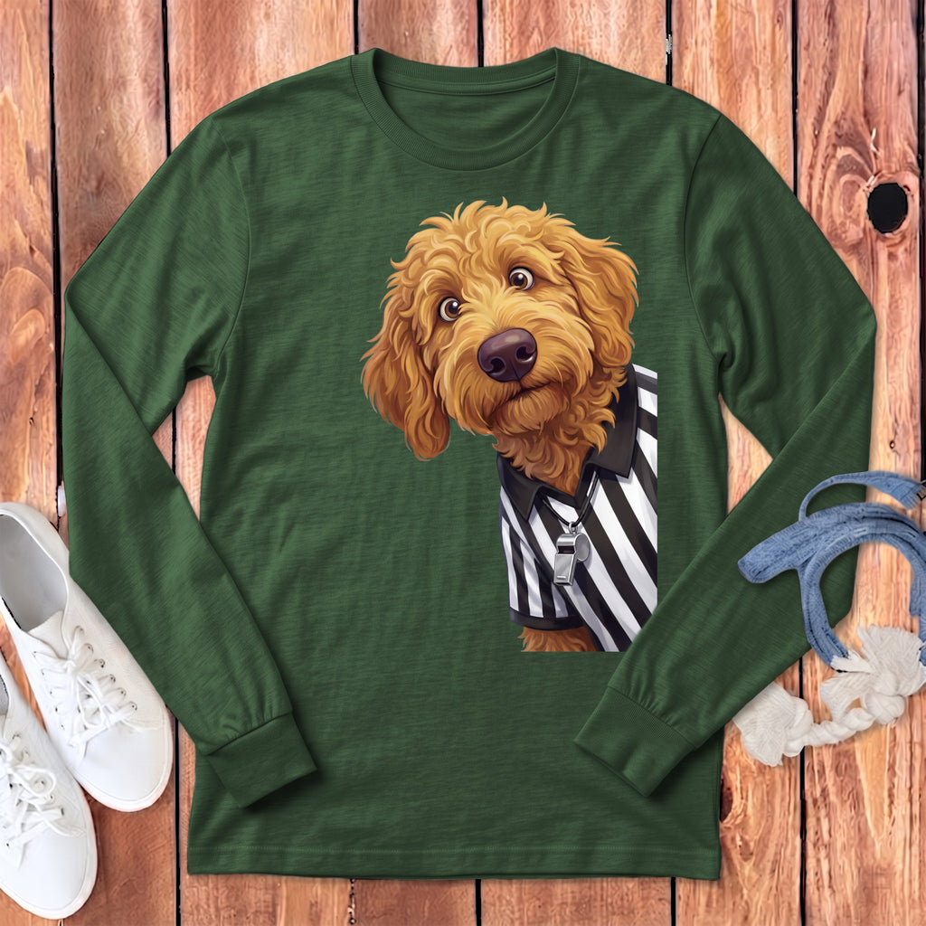 Golden doodle dog wearing a referee shirt and whistle on a green long sleeve shirt.