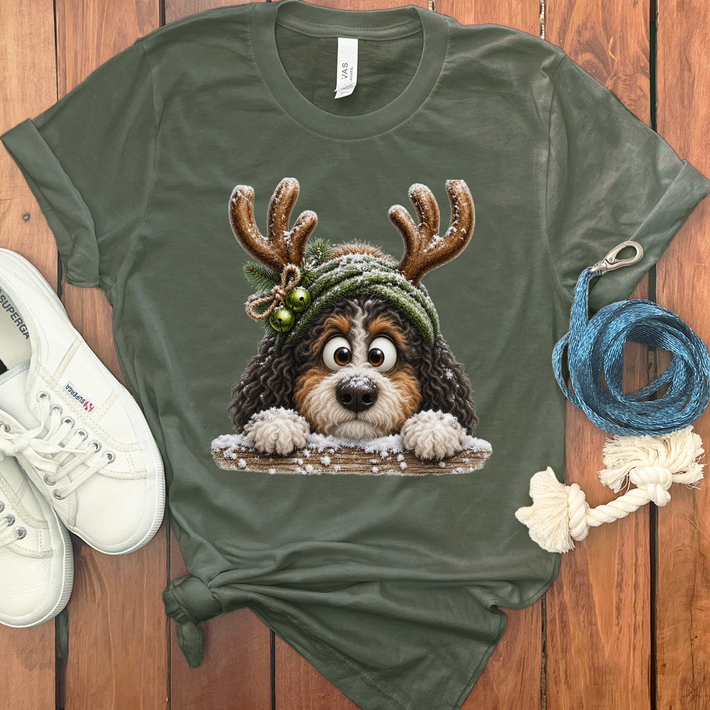 T-shirt with a cartoon Bernese Mountain Dog wearing antlers and a winter hat.