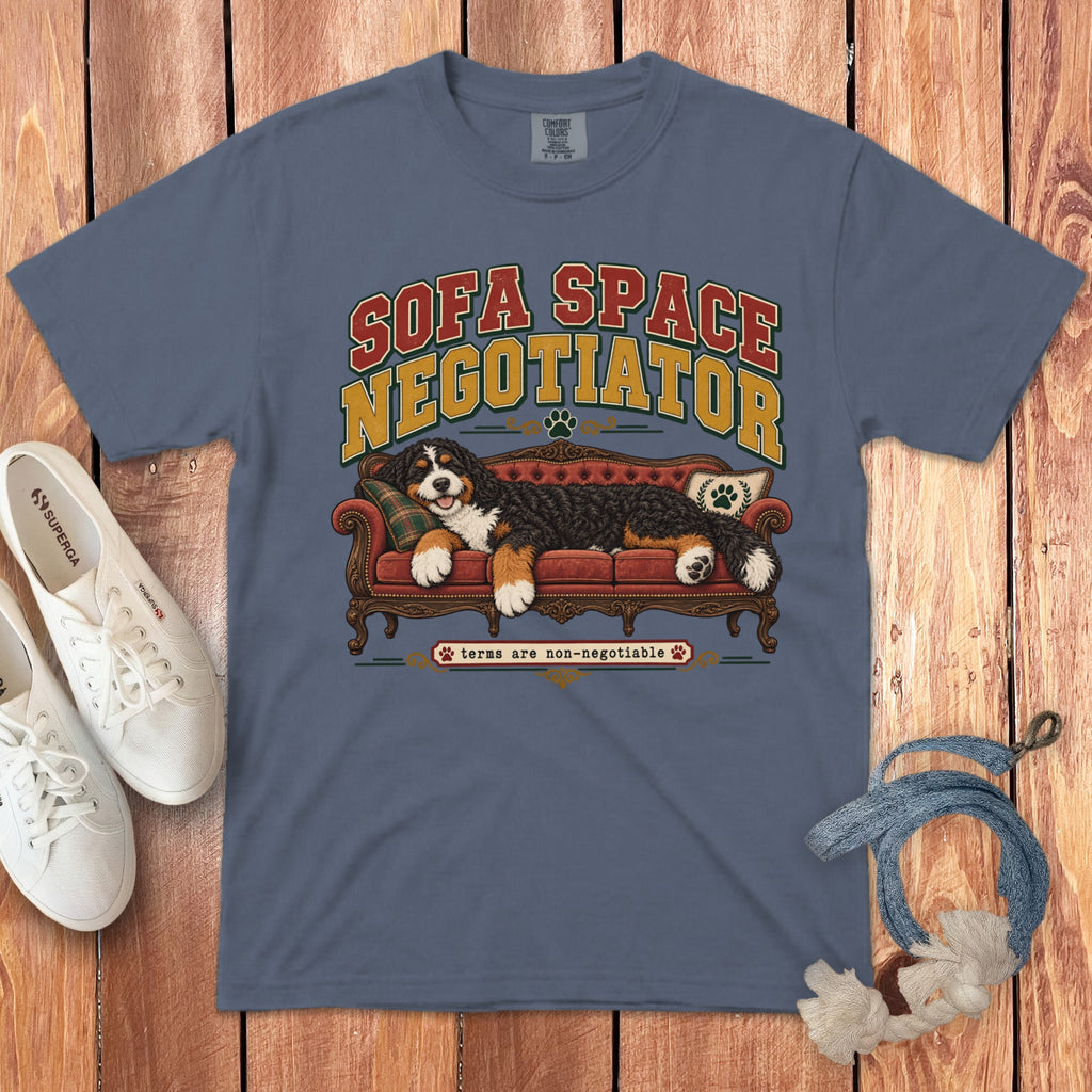 Slate blue t-shirt featuring graphic text and a Bernese Mountain Dog resting on a red sofa.