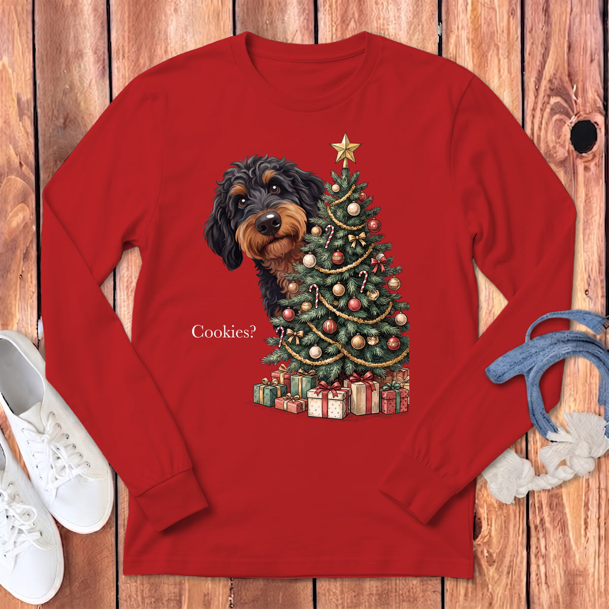 Dog peeking from behind a Christmas tree with presents, text says "Cookies?".