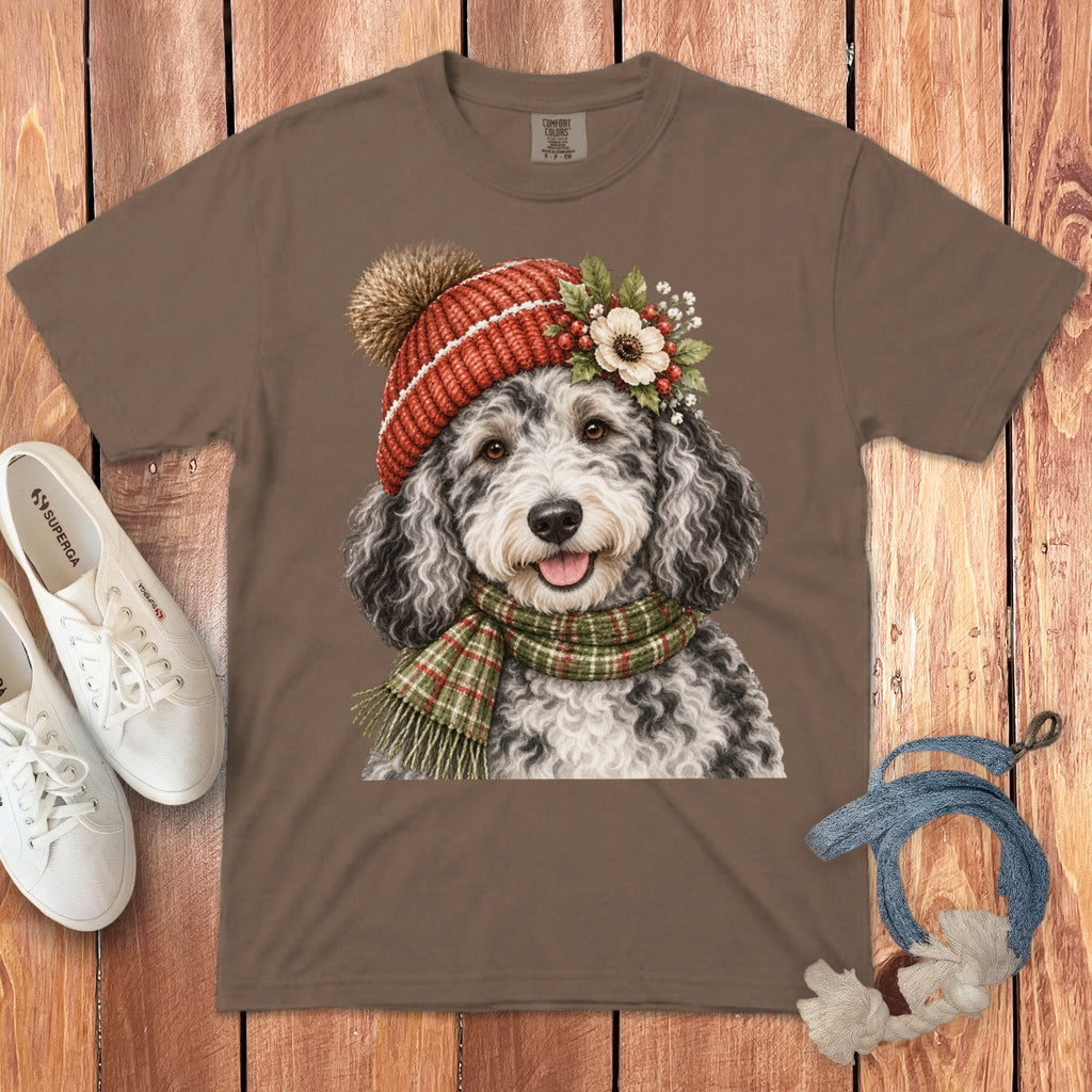 Brown t-shirt featuring a doodle wearing a red knitted hat and scarf.