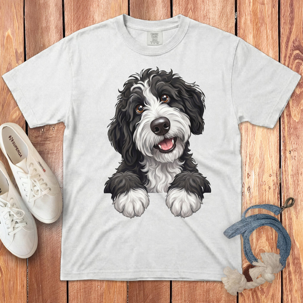 White t-shirt featuring a black and white fluffy dog illustration.