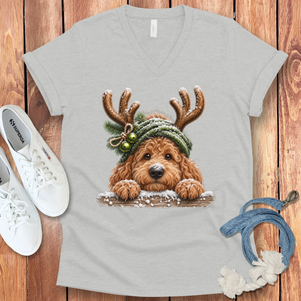 Light gray t-shirt with a doodle dog wearing antlers and a green hat.