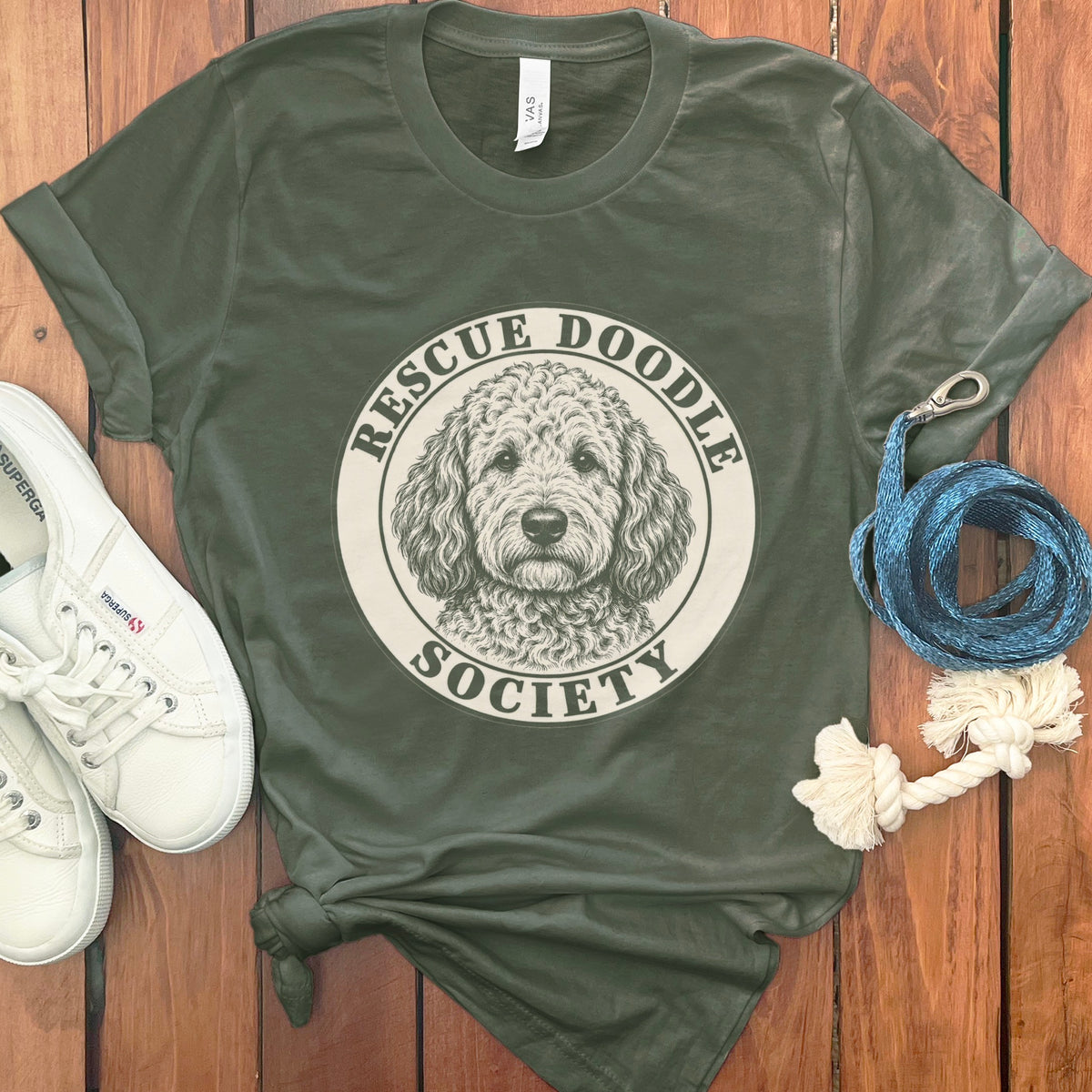 Green t-shirt with "Rescue Doodle Society" text and doodle dog graphic.