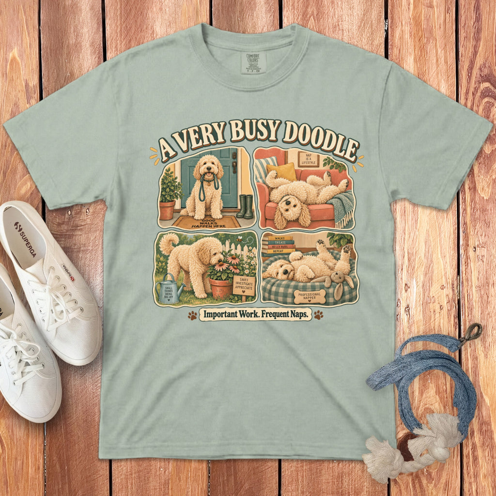 T-shirt with four illustrated scenes of a doodle dog titled "A Very Busy Doodle."
