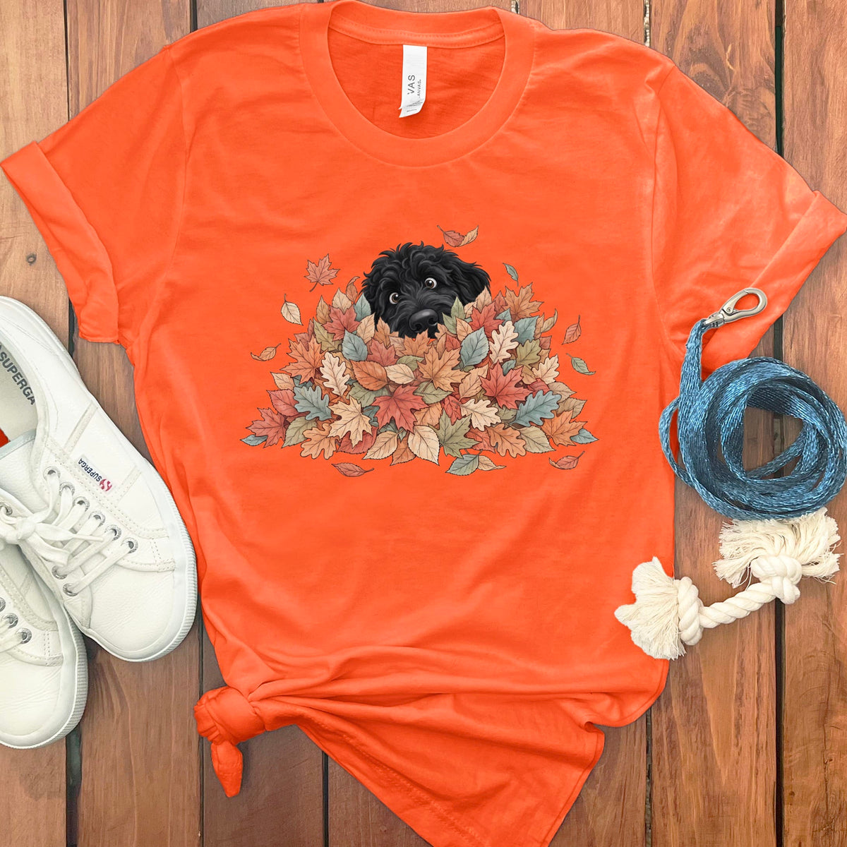 Black Goldendoodle Peeking Leaf Pile T-Shirt in S / Orange by Puppy Jo