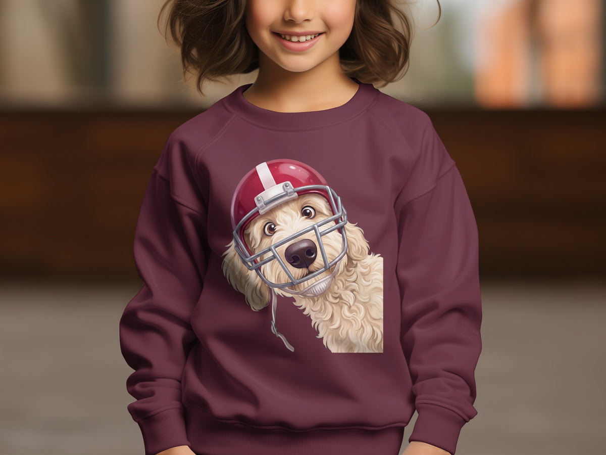 Maroon sweatshirt featuring a cream doodle dog wearing a football helmet.