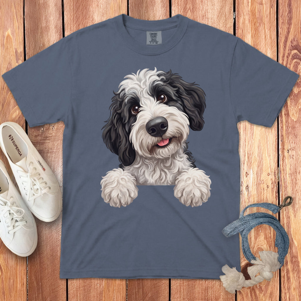 Blue t-shirt with a black and white doodle dog illustration, white sneakers, and blue rope.
