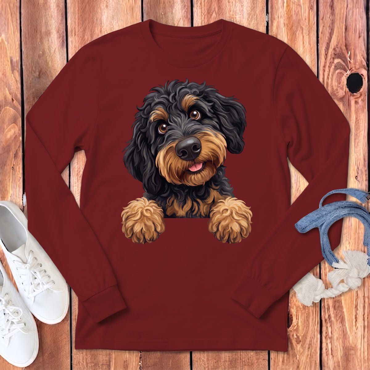 Maroon long-sleeve shirt with a painted black and tan doodle dog graphic.