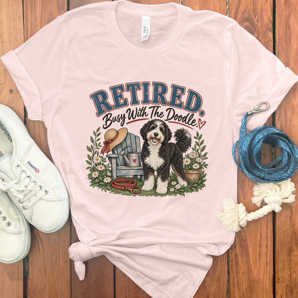 Pink t-shirt with "Retired Busy With The Doodle" graphic and a doodle dog.