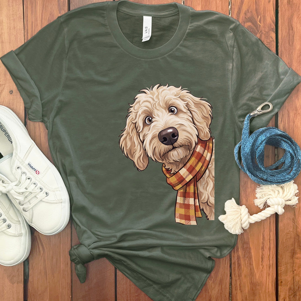Olive green t-shirt with a doodle dog wearing a plaid scarf graphic.