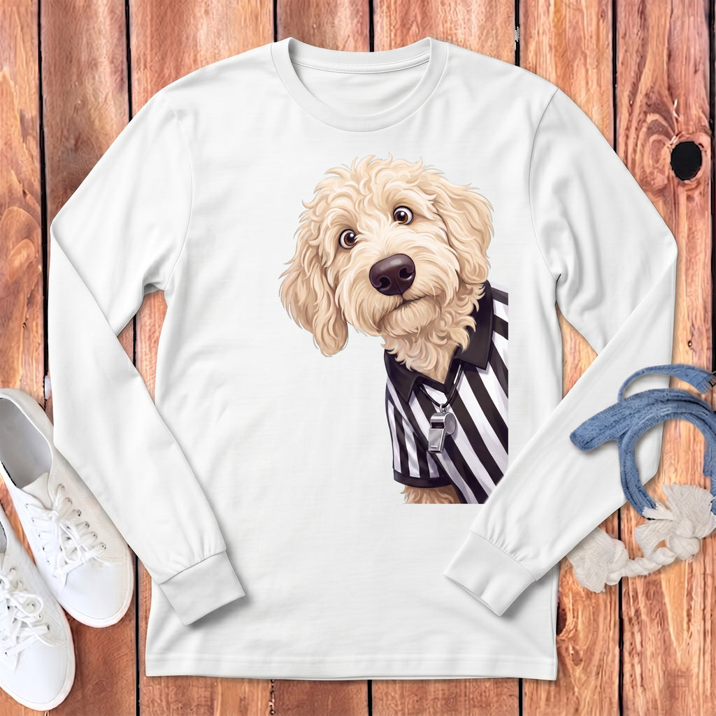 Goldendoodle dog wearing a black and white striped referee shirt with a whistle.