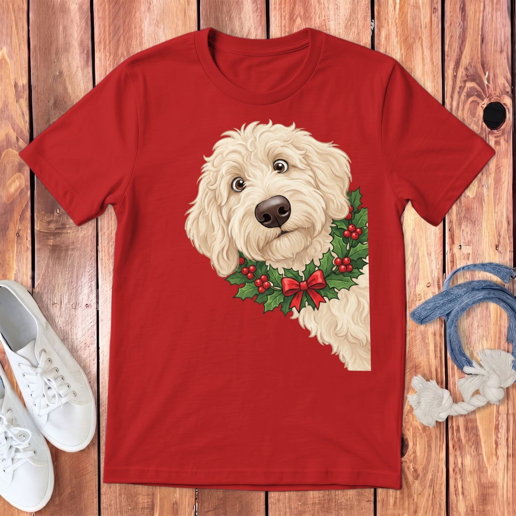 Red t-shirt with a cream doodle dog wearing a holly wreath and red bow.