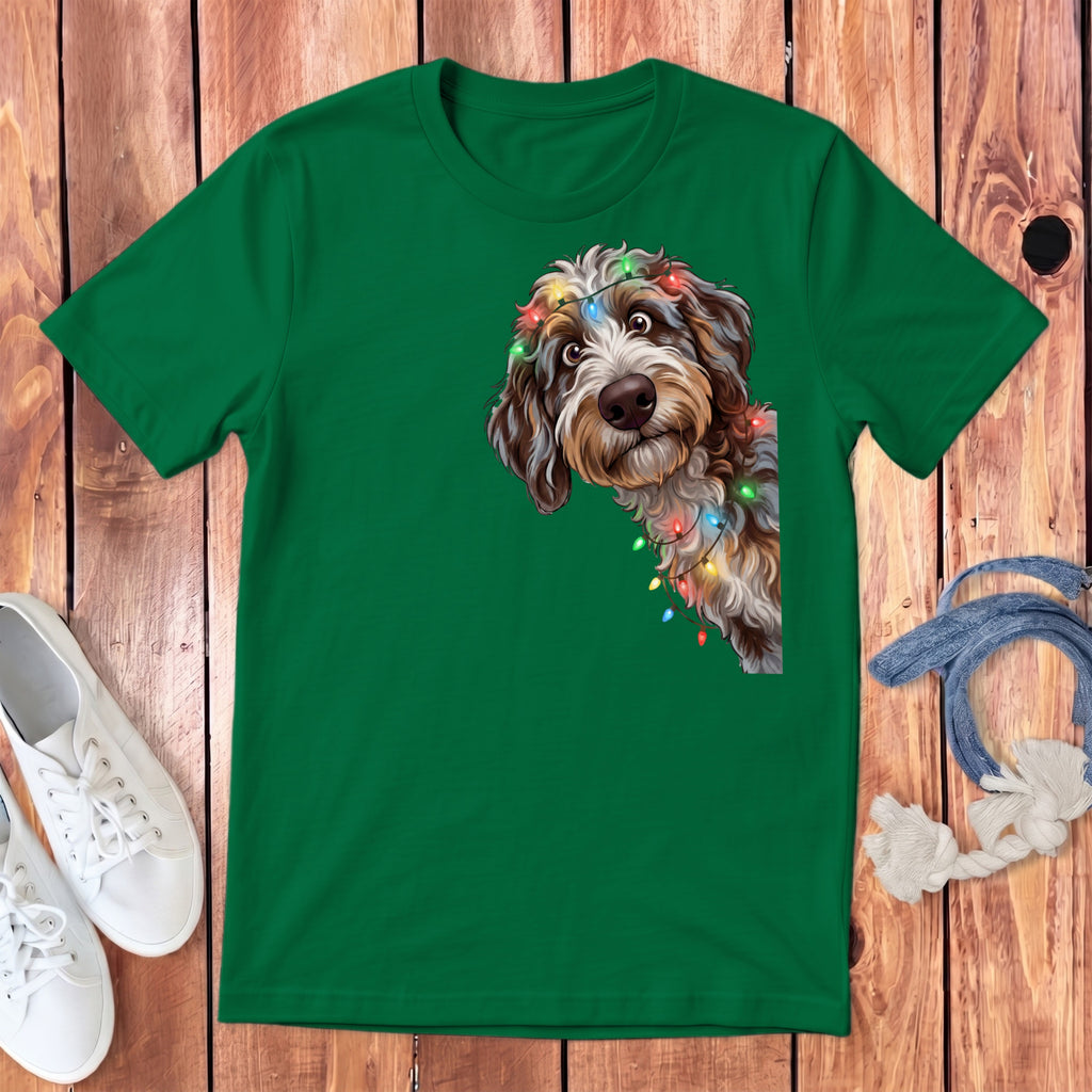 Green t-shirt with a doodle dog wearing colorful Christmas lights.