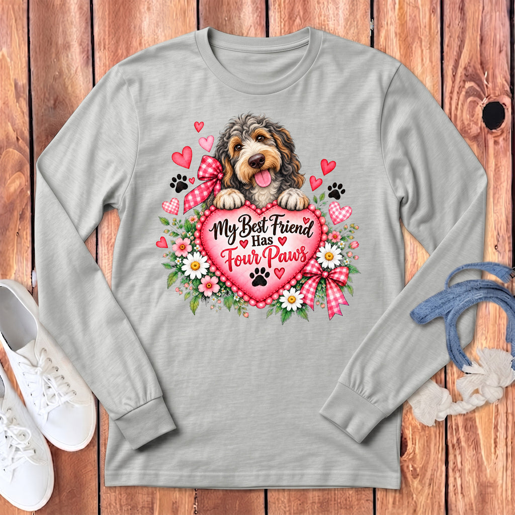 Light gray long-sleeve t-shirt with a graphic of a fluffy dog resting on a pink heart surrounded by flowers and text.