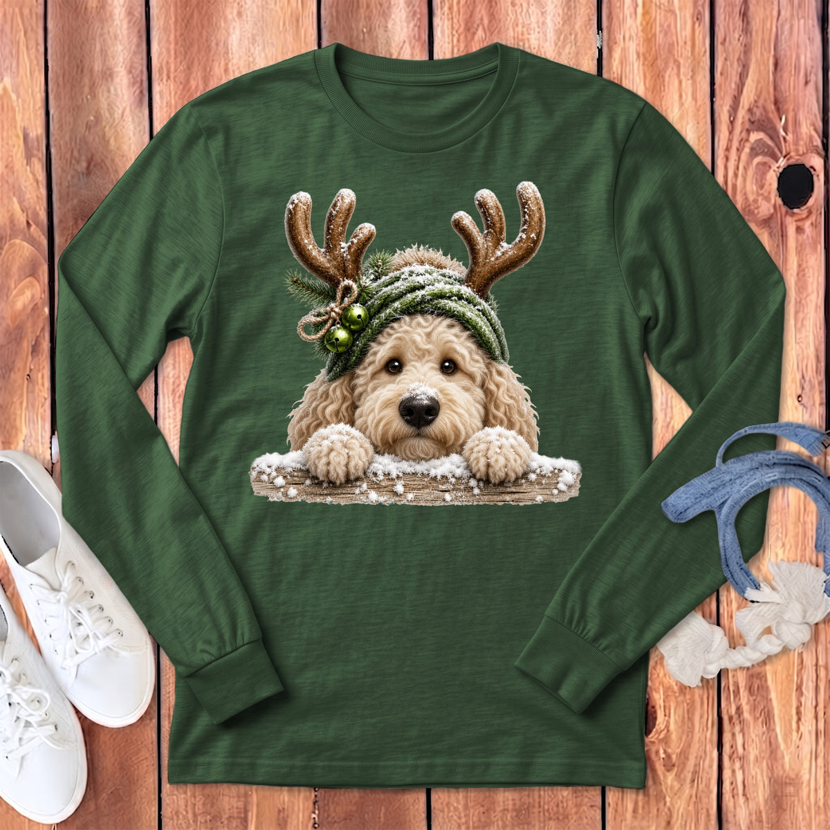 Green long-sleeve shirt with a doodle dog wearing reindeer antlers and a snow-covered hat.