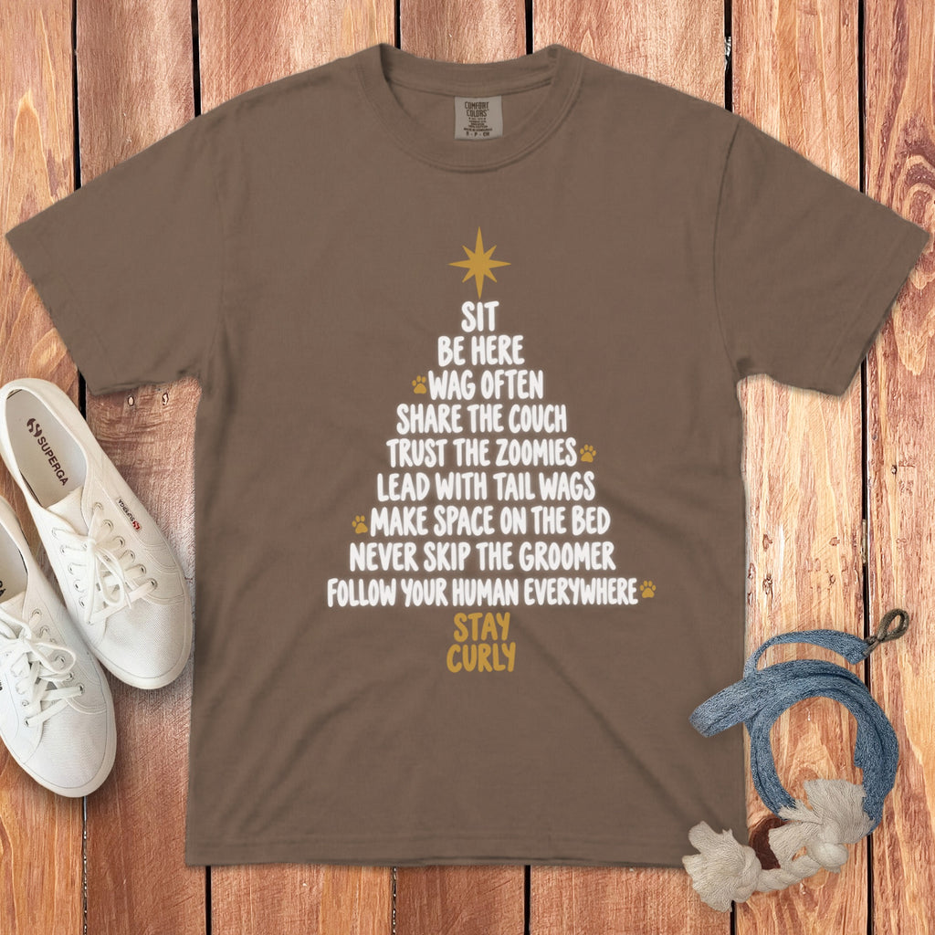 Brown t-shirt featuring a Christmas tree graphic made of dog rules and gold paw prints.