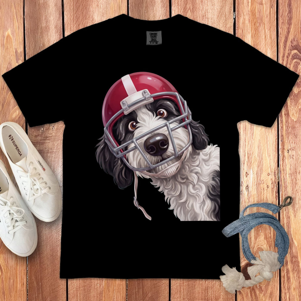Black t-shirt with a cartoon black and white dog wearing a red football helmet.