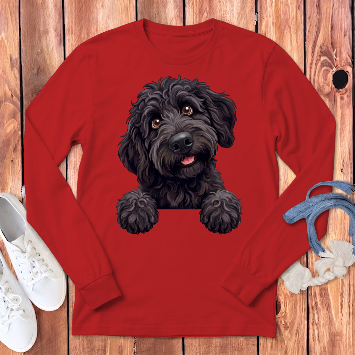Red long-sleeved shirt with a black doodle dog illustration peeking over the collar.