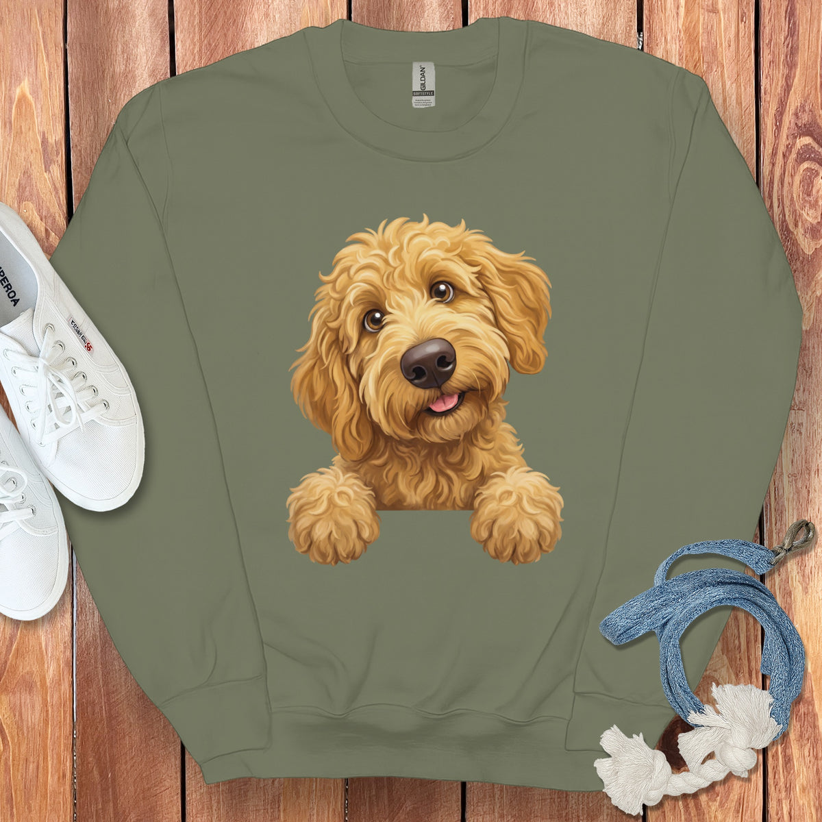 Olive green sweatshirt with a cute illustration of a goldendoodle puppy.