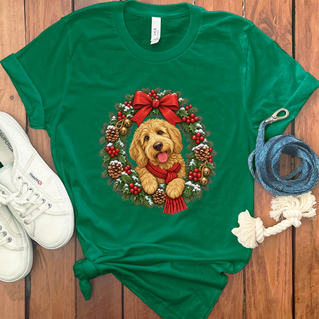 Green t-shirt featuring a goldendoodle wearing a red scarf inside a Christmas wreath.