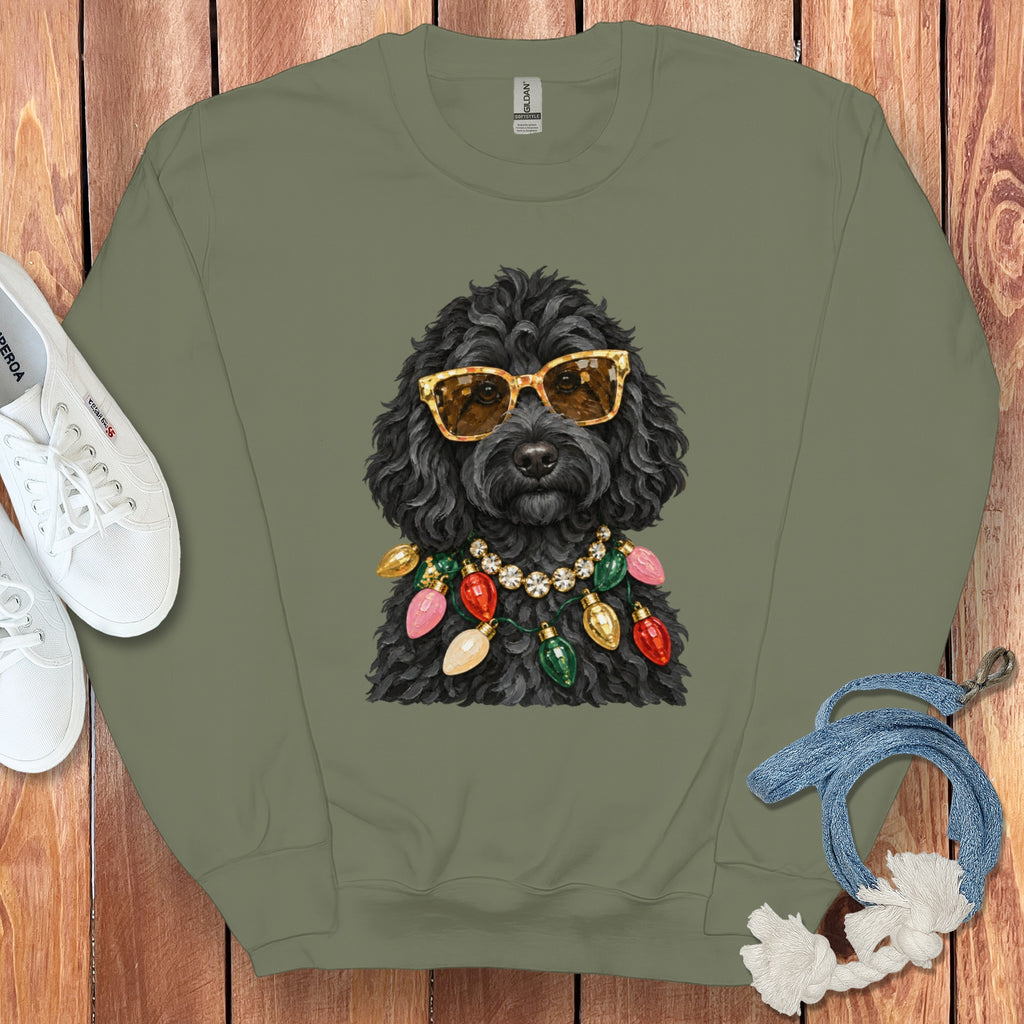 Black poodle wearing sunglasses and a string of colorful Christmas lights.