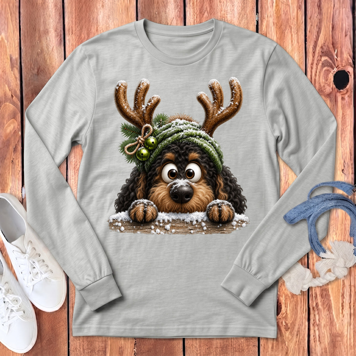 Light gray long-sleeve shirt with a cartoon dog wearing antlers and a green hat.