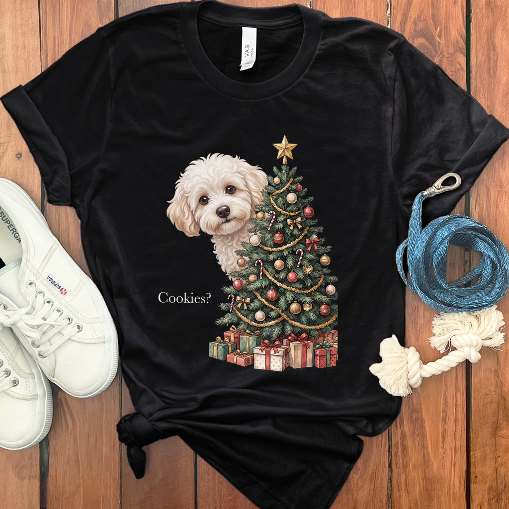 Black t-shirt with a fluffy white dog peeking from behind a decorated Christmas tree.