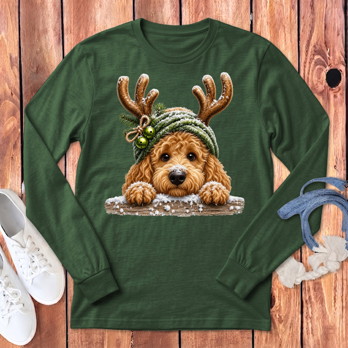 Green long-sleeve t-shirt featuring a cartoon dog wearing reindeer antlers and a Santa hat.