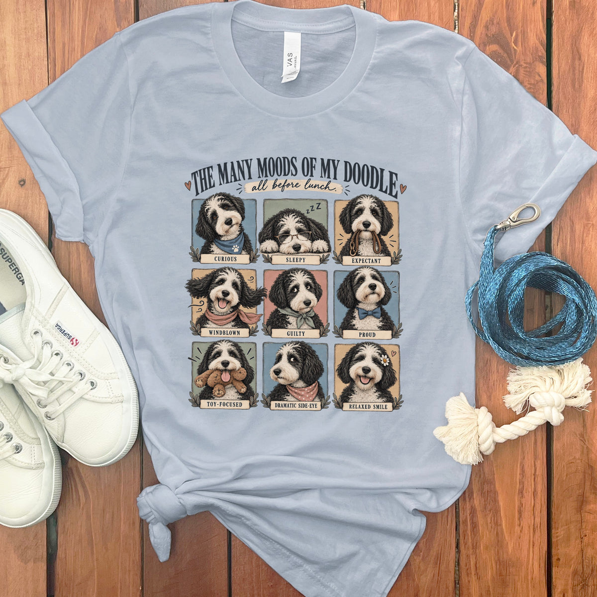 Shirt with nine illustrations of a doodle dog displaying various moods and labels.