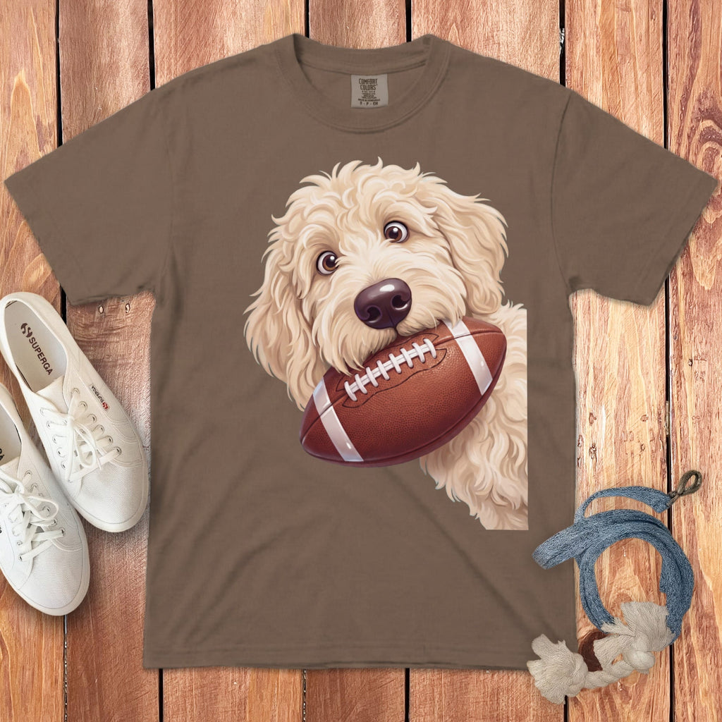 Brown t-shirt with a doodle dog holding a football graphic.