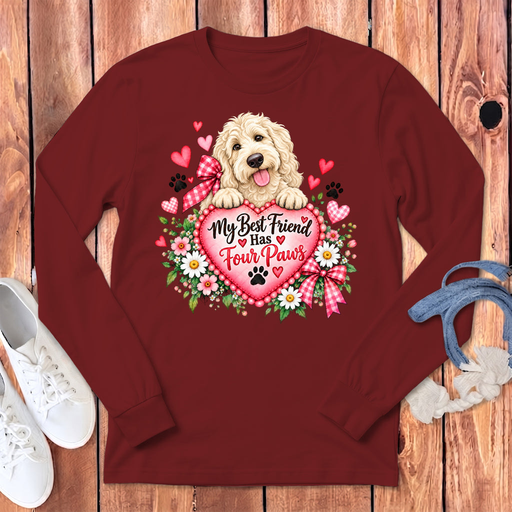Maroon long-sleeve t-shirt with a graphic of a fluffy dog and a heart that reads My Best Friend Has Four Paws.