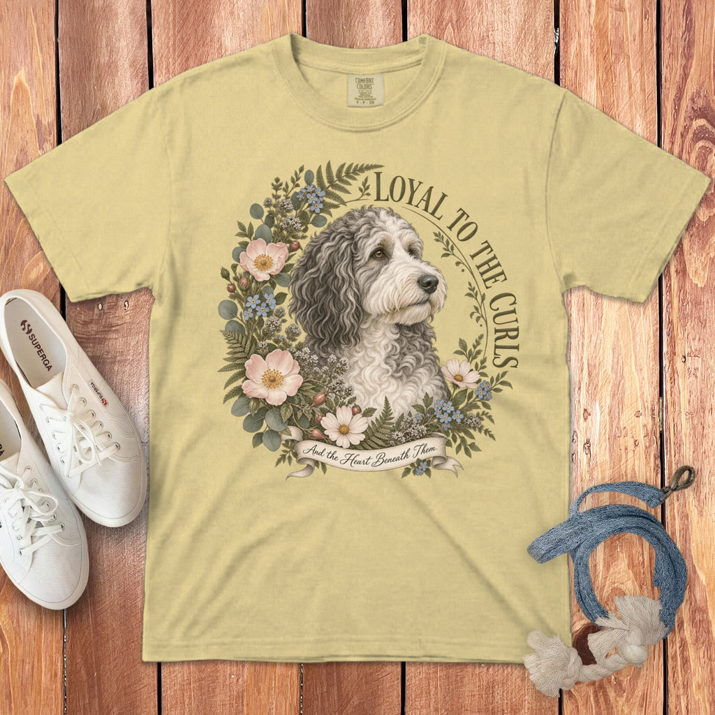 Light yellow t-shirt with dog portrait surrounded by flowers, "Loyal to the Curls" text.