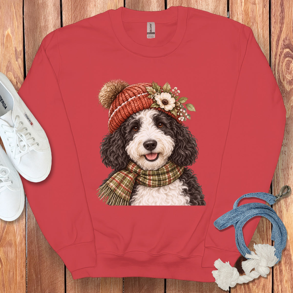 Crewneck sweatshirt with a watercolor print of a Bernedoodle wearing a winter hat and scarf.