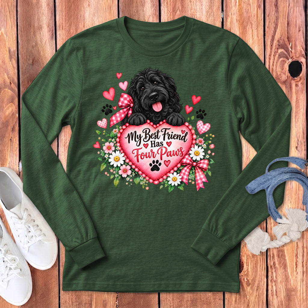Dark green long-sleeve t-shirt with a graphic of a black dog holding a pink heart reading My Best Friend Has Four Paws surrounded by flowers.