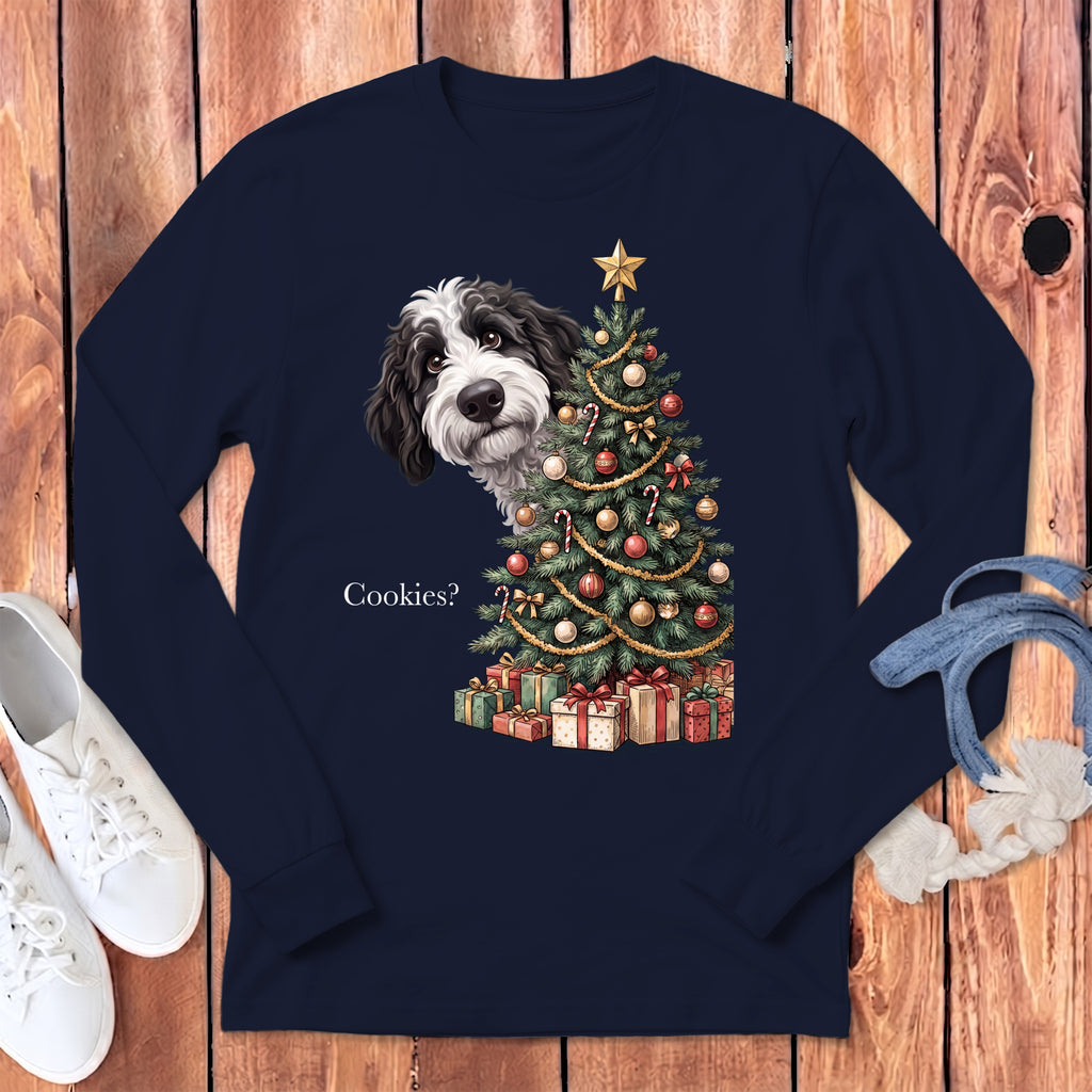 Black and white dog peeking by a decorated Christmas tree with presents.
