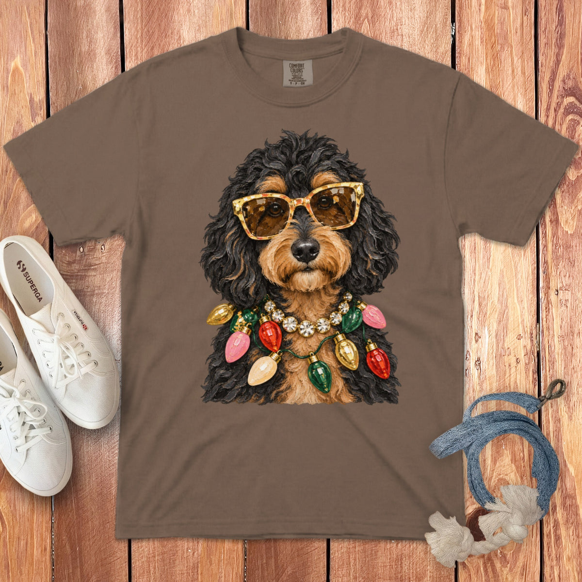 Brown t-shirt with a dog wearing sunglasses and a Christmas light necklace.
