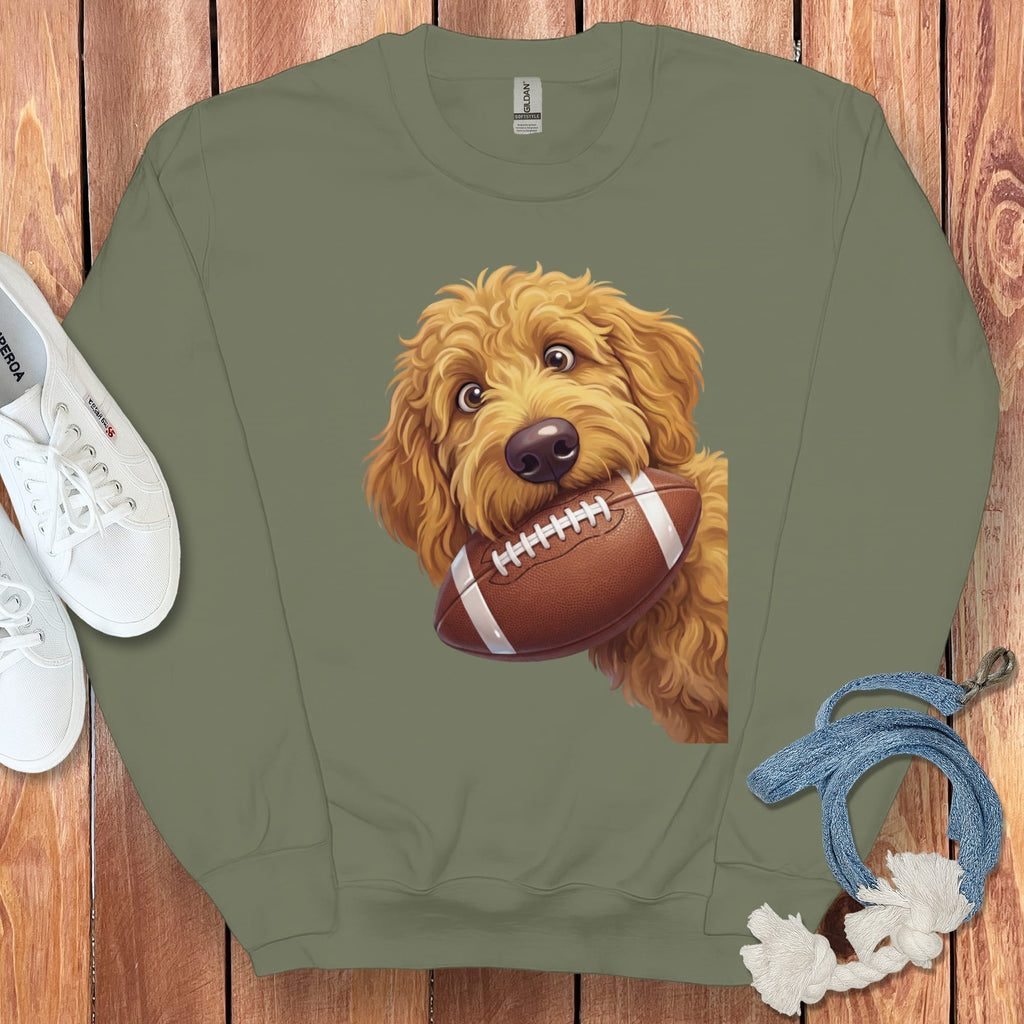 Crewneck sweatshirt with a cartoon goldendoodle holding a football.