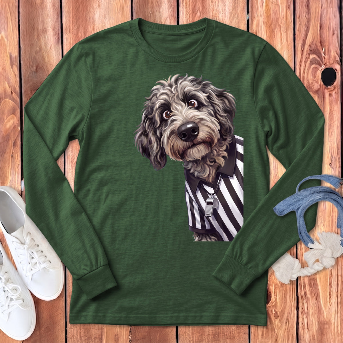 Green long-sleeve shirt with a cartoon dog wearing a referee shirt and whistle.