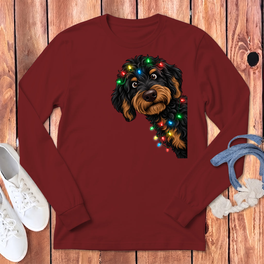 Maroon long-sleeve shirt with a doodled dog wearing colorful Christmas lights.