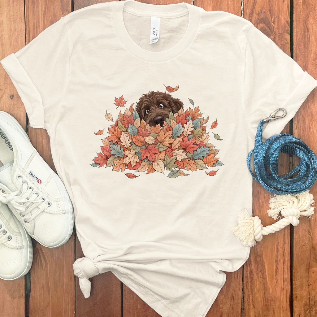 Chocolate Goldendoodle Peeking Leaf Pile T-Shirt in Natural / S by Puppy Jo