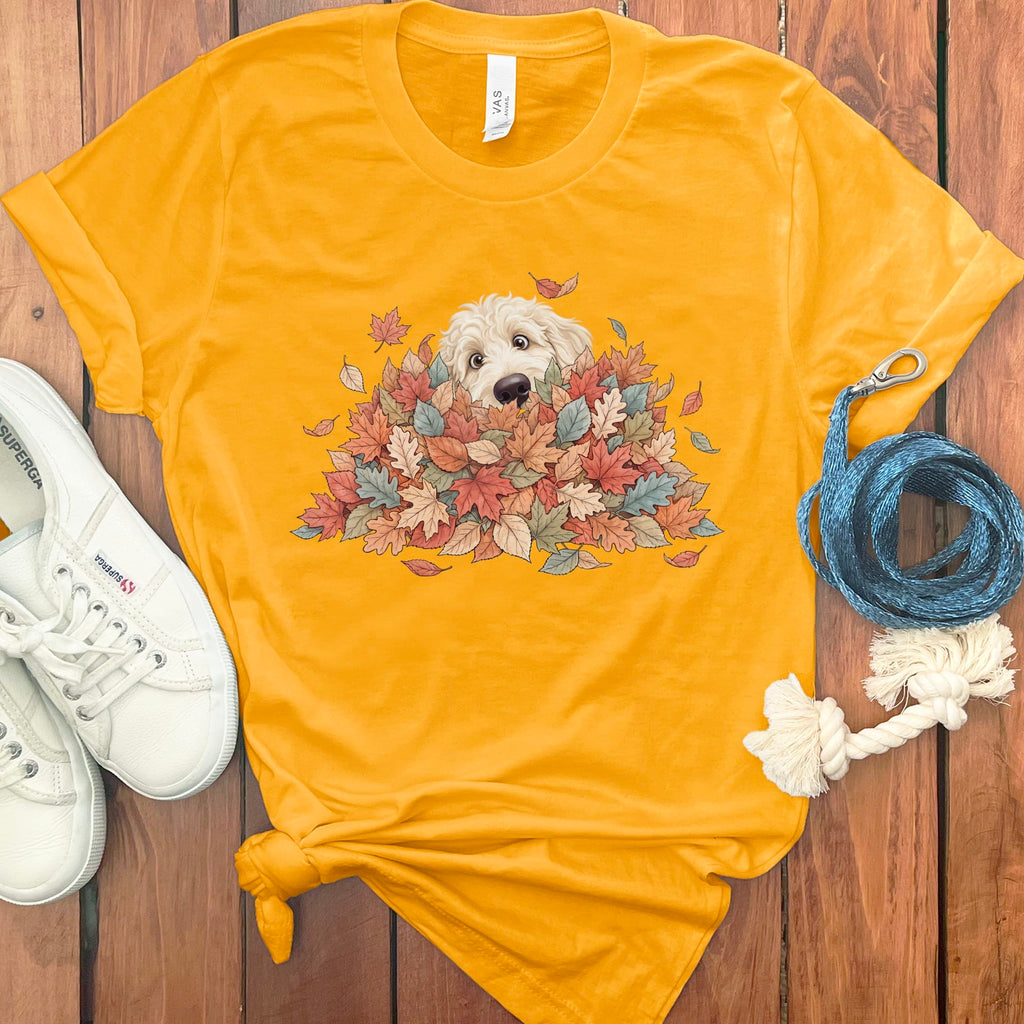 Cream Goldendoodle Peeking Leaf Pile T-Shirt in Gold / S by Puppy Jo