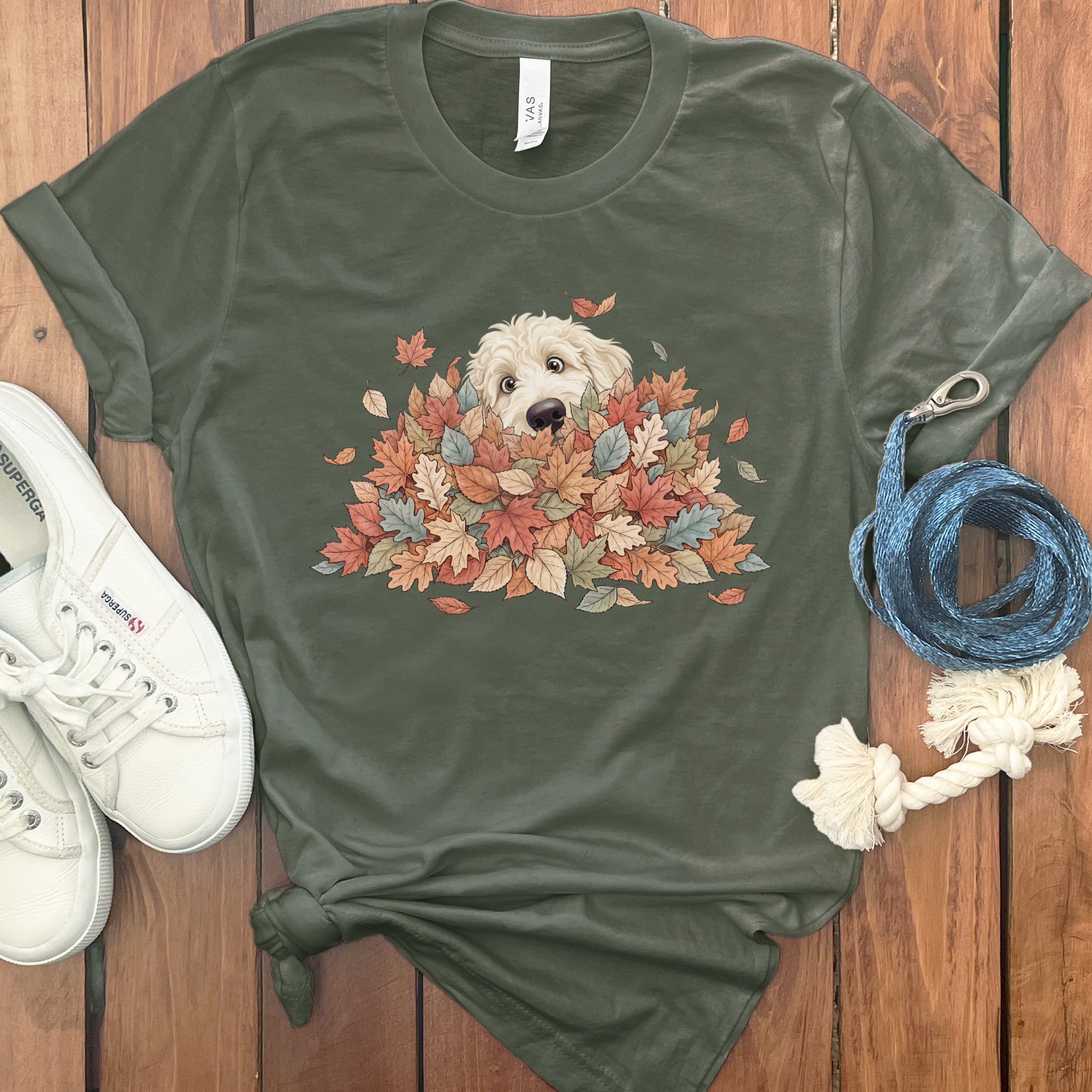 Cream Goldendoodle Peeking Leaf Pile T-Shirt in Military Green / S by Puppy Jo