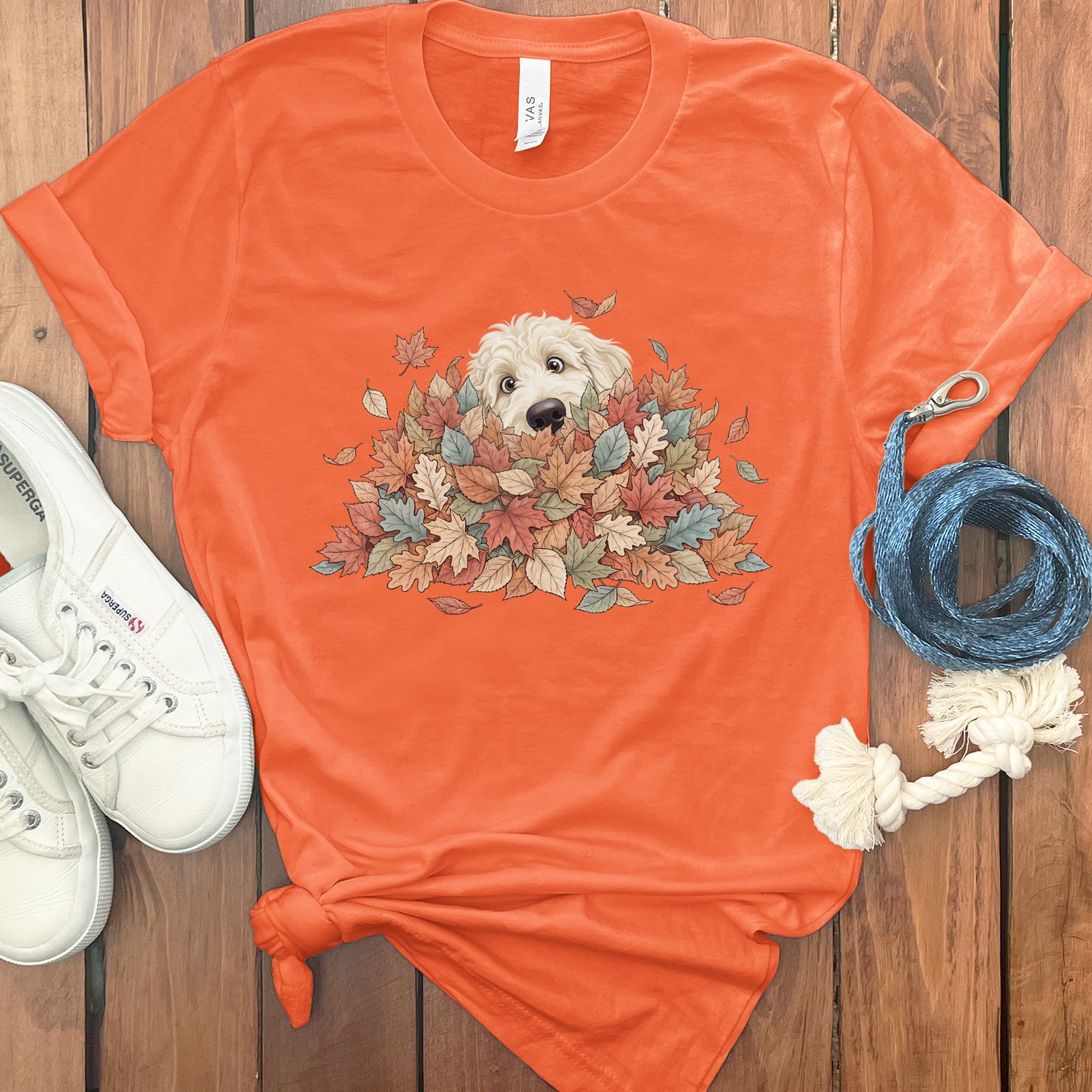 Cream Goldendoodle Peeking Leaf Pile T-Shirt in Orange / S by Puppy Jo