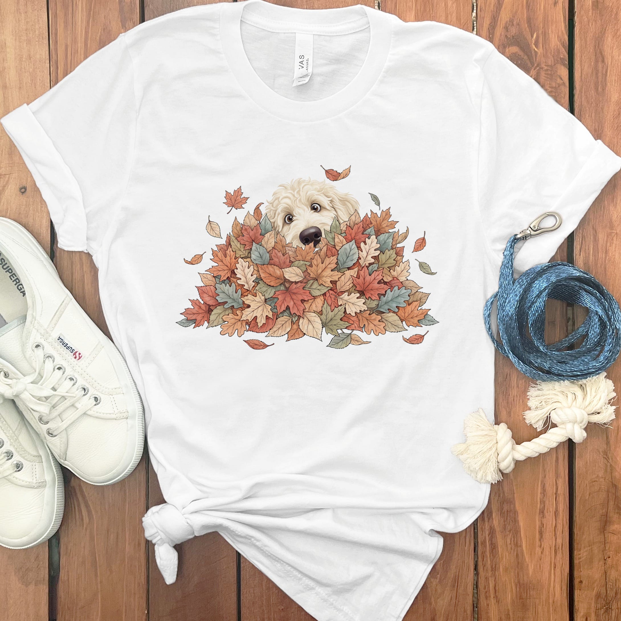Cream Goldendoodle Peeking Leaf Pile T-Shirt in White / S by Puppy Jo