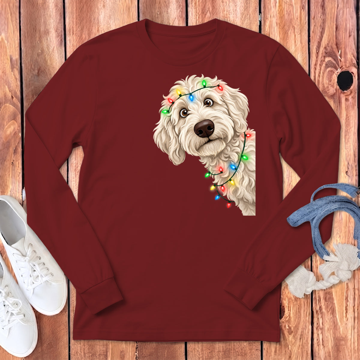 Maroon long sleeve shirt with a doodle dog wearing Christmas lights graphic.